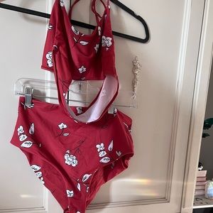 Two pice bikini in burnt orange with while floral print. Great condition!